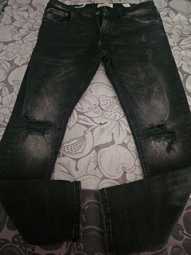 Vaqueros rotos negros y azules