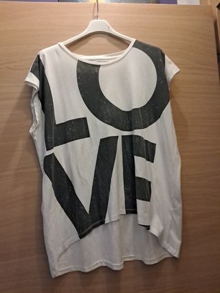 Top bianco lungo dietro, corto davanti