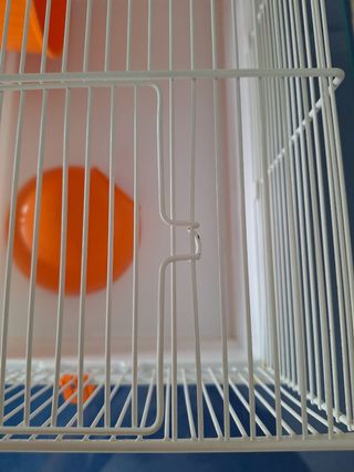 Jaula hamster naranja y blanca