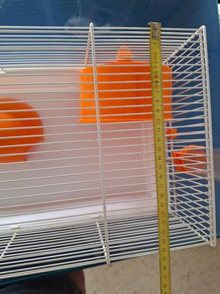 Jaula hamster naranja y blanca