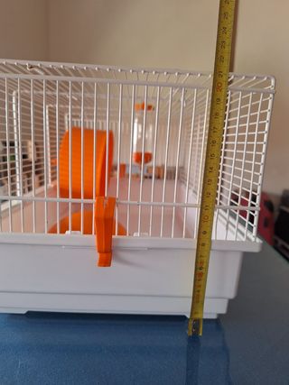 Jaula hamster naranja y blanca