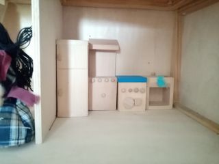 Casa de muñecas de madera