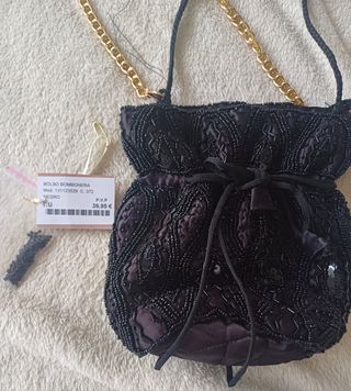 Bolso bombonera Monet negro y dorado