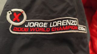 Chubasquero mujer moto Jorge Lorenzo negro