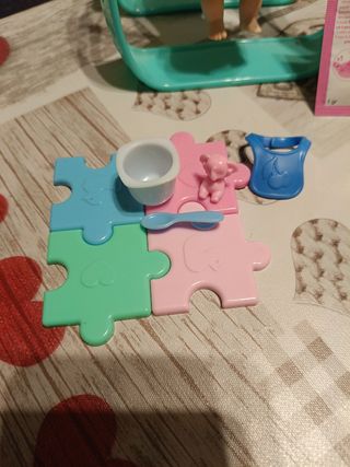 Muñeca Amiccichi columpio