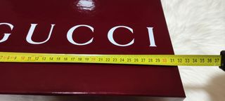 Caja y bolsa Gucci