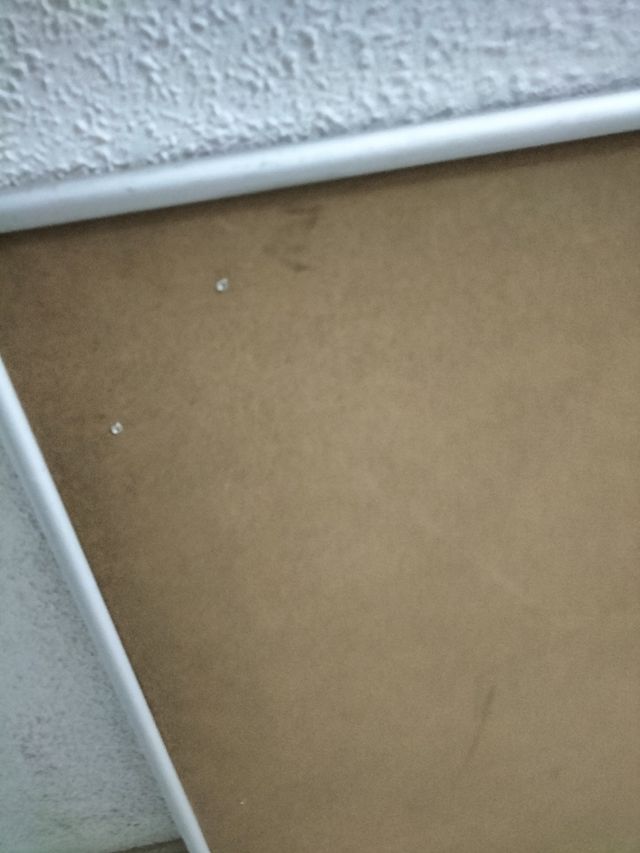 Marco plateado.70 x 60 aprox.