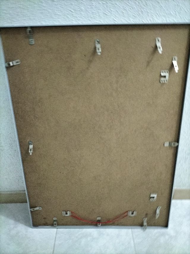 Marco plateado.70 x 60 aprox.