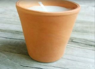 Velas en macetas de barro