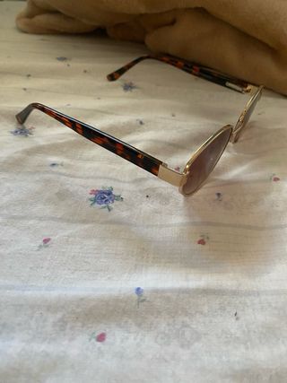 Gafas sol redondas doradas