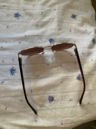 Gafas sol redondas doradas