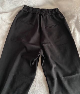 Pantalones pinza negros con raya blanca