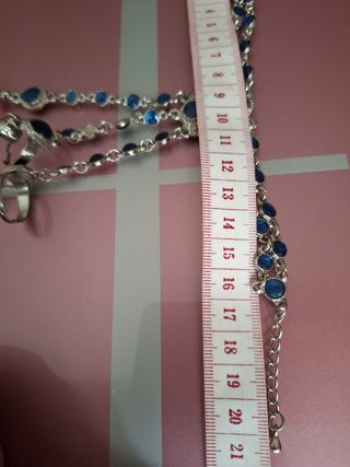 Joya de mano azul y plateado