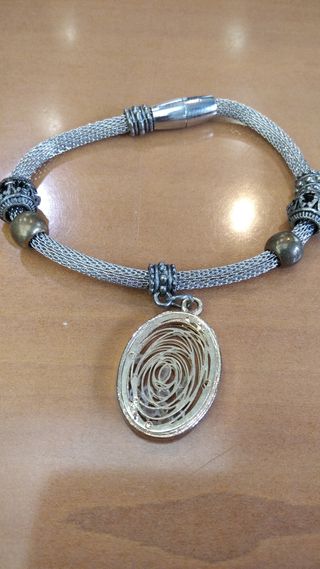 Pulsera Plata con dije dorado