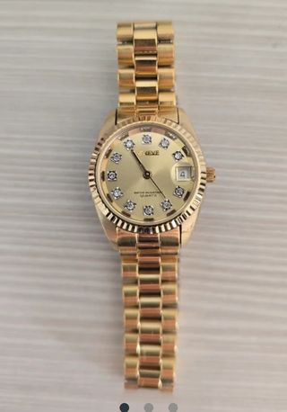 Reloj Geneve dorado con diamantes