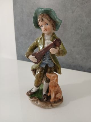 Statuetta Bambino con Cane che Suoba Ceramica Capo