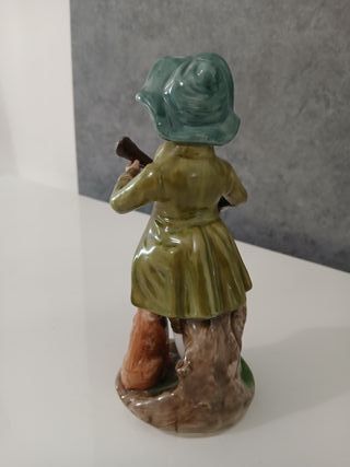 Statuetta Bambino con Cane che Suoba Ceramica Capo