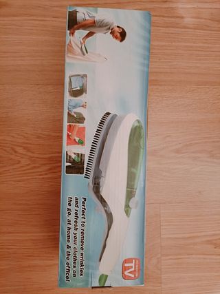 Plancha de viaje vertical nueva en su caja
