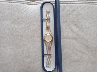Reloj Vogue dorado y plateado