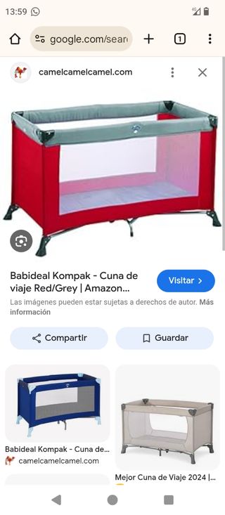 Cuna viaje de color rojo entera sin colchón.