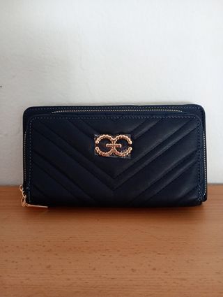 Monedero azul acolchado