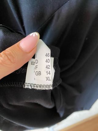 Top negro Coccapani peplum con collar pedrería XL