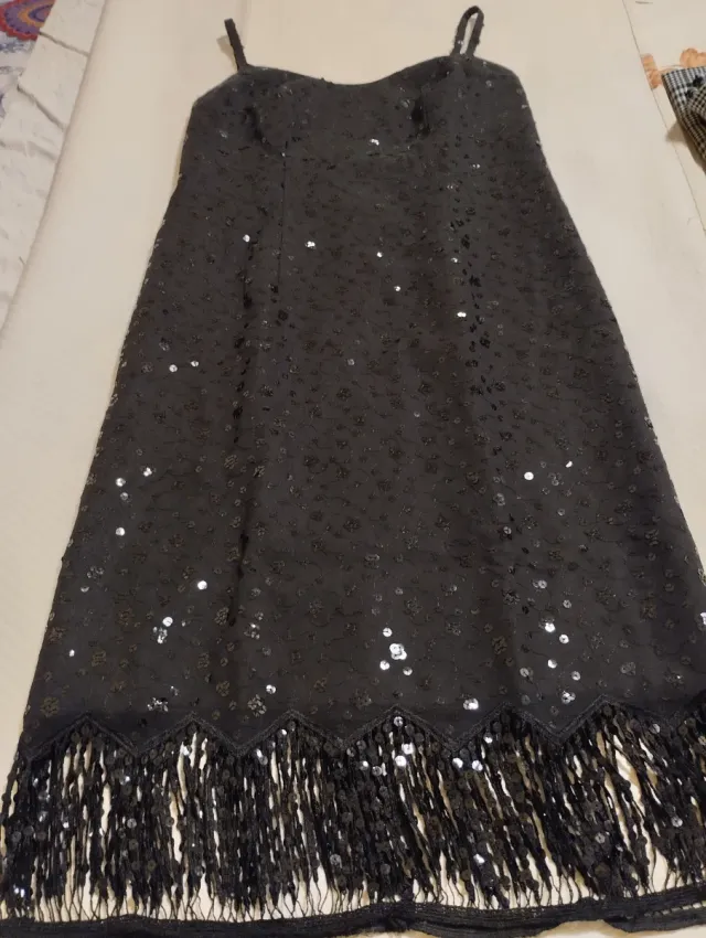 Vestido negro lentejuelas
Axilas 45cm largo 112