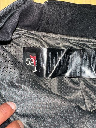 Mono piel Dainese cuero negro-rojo