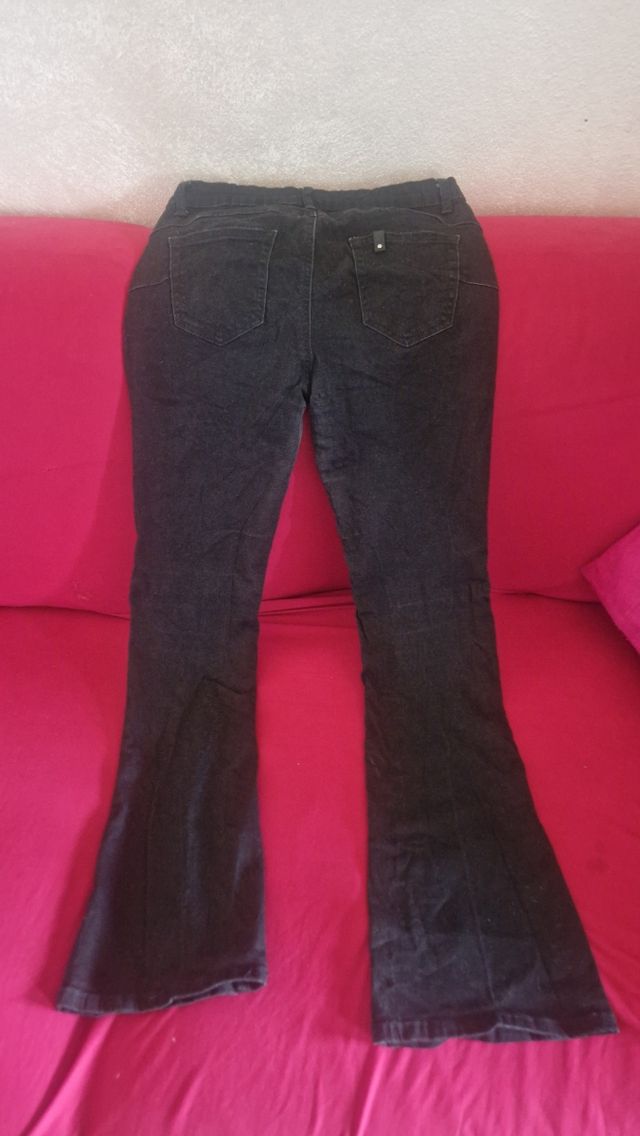 Jeans neri push up a zampa elasticizzati vita alta