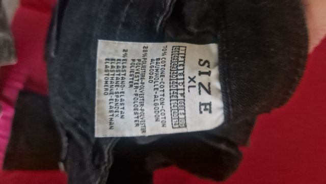 Jeans neri push up a zampa elasticizzati vita alta