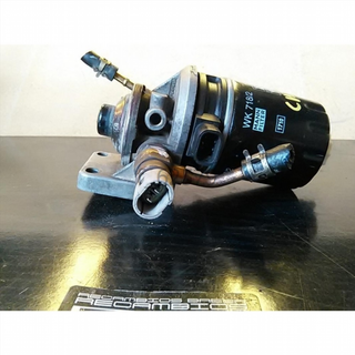 Soporte filtro gasoil Mitsubishi Carisma H