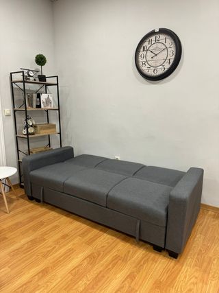 Sofá cama gris con arcón