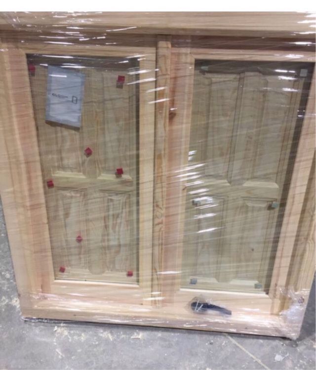 Ventana de madera con cristal climalit