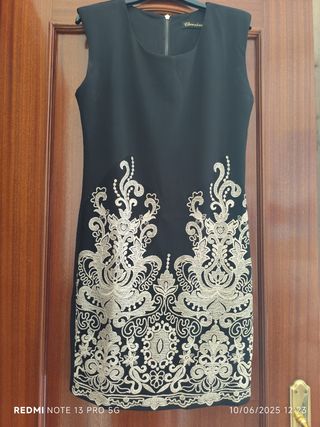 Vestido negro y dorado talla M.con torerilla de en