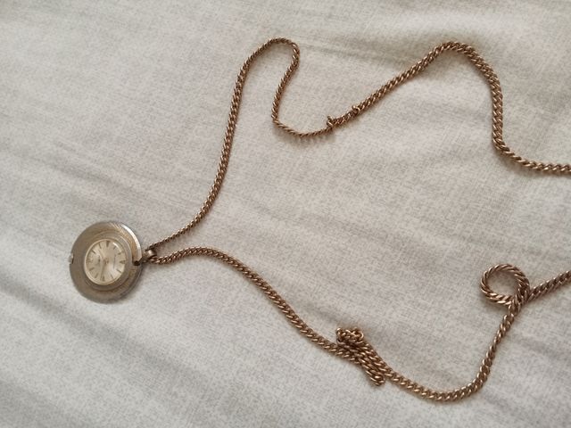 Reloj  dorado y plateado antiguo