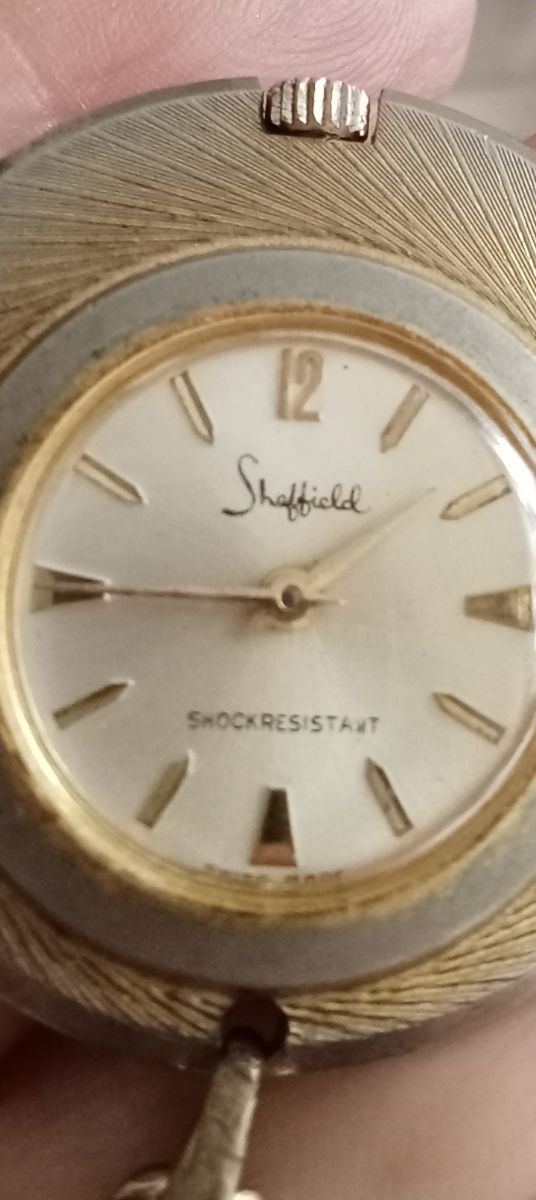 Reloj  dorado y plateado antiguo