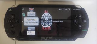 PSP 1000 + muchos  juegos