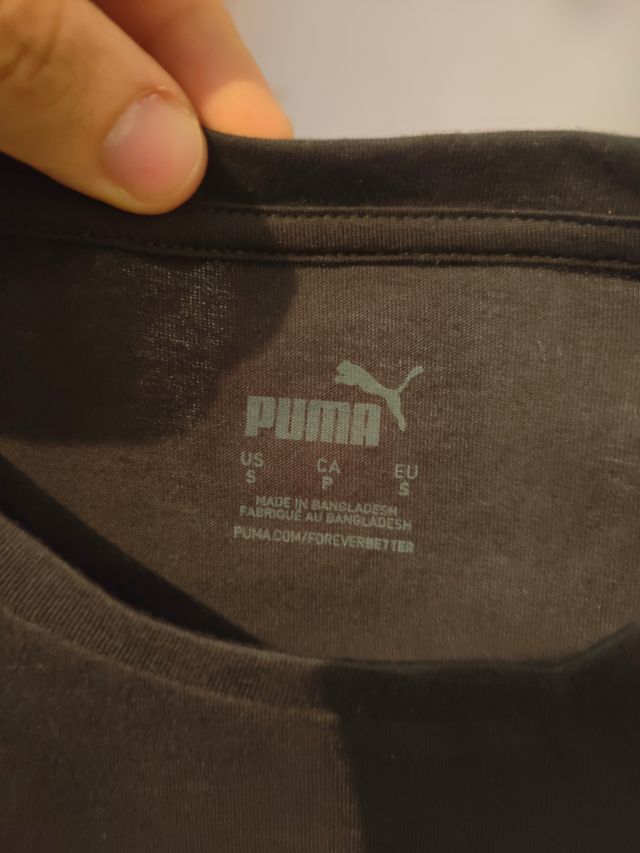 Camiseta Puma negra y dorada chica