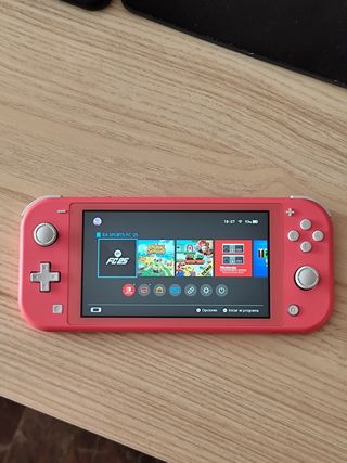 Nintendo Switch Lite Rosa, 1 Juego y cargador.