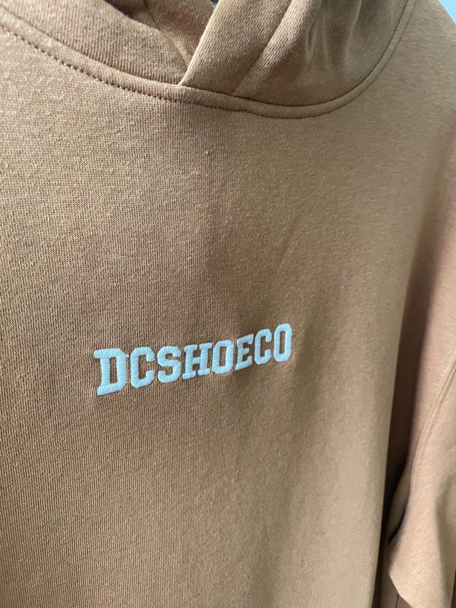 Felpa DC marrone nuova.