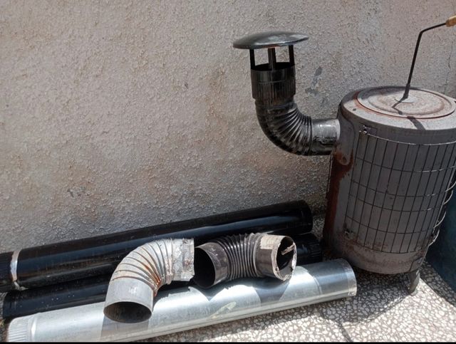 Estufa leña redonda antigua