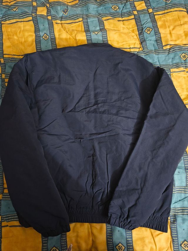 Giubbino antivento Asics 