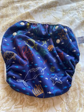 Pañal y zapatos playa bebé