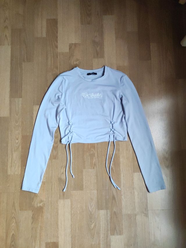 Top celeste con cordones