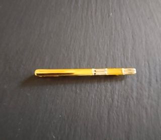 Gemelos y pisa corbata dorados