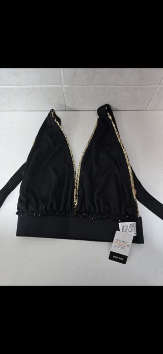 Top negro y dorado brillante