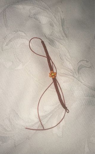 Pulsera tejida marrón-naranja