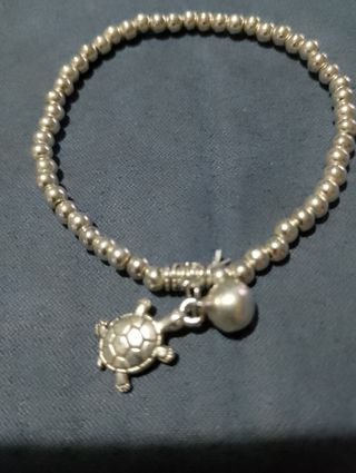 Braccialetto argento tartarughe e campanellino