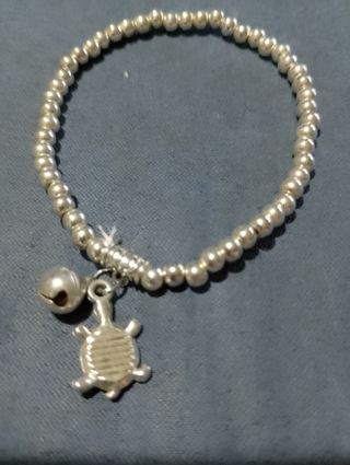 Braccialetto argento tartarughe e campanellino