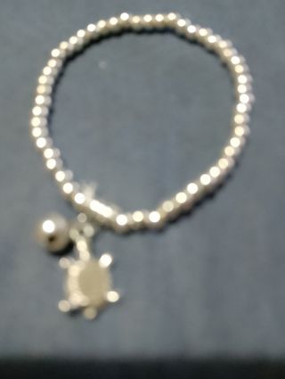 Braccialetto argento tartarughe e campanellino
